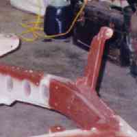 Closeup of the frame rail, showing the modified tower and frame reinforcement plate